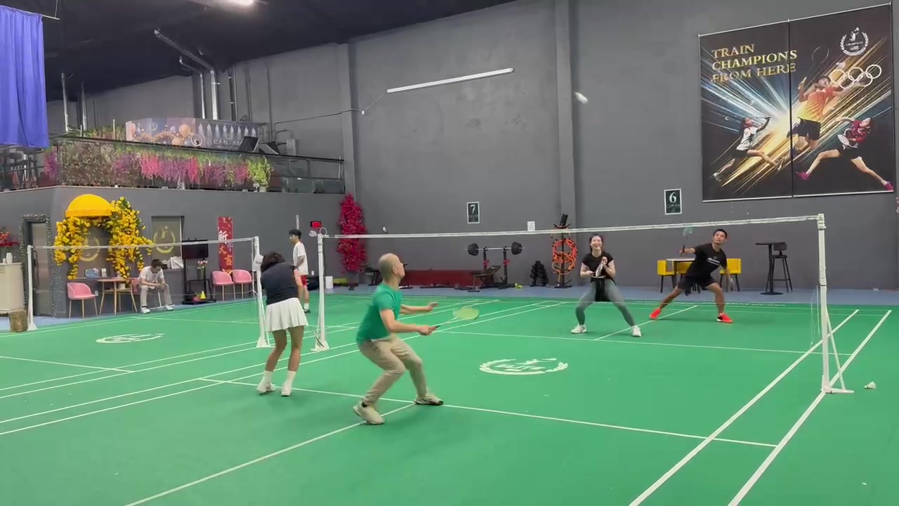Green shirt midcourt ready stance